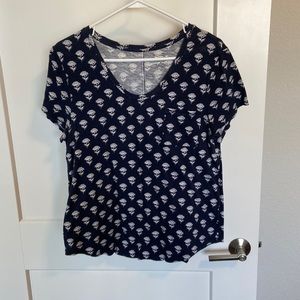 Navy and blue tee from Loft. Has a floral print and picked on the left.